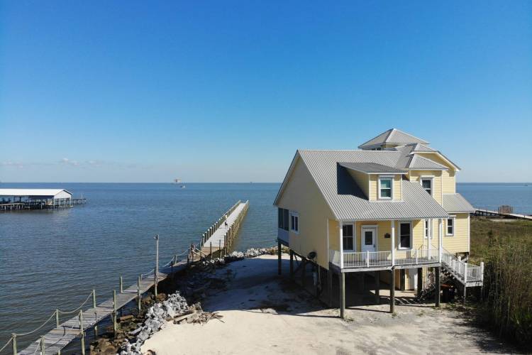 House adjacent to fishing pier